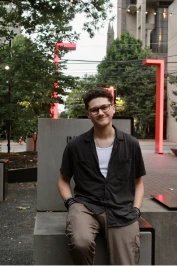 Owen leaning on a metal block.